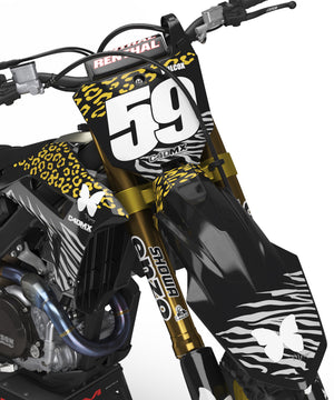 Honda CRF 250X with a custom dirt bike graphics kit. Black with gold leopard print and silver zebra print.
