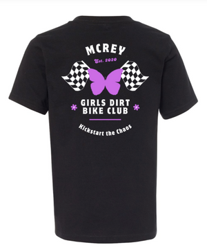 Black shirt with a purple butterfly in front of checkered flags and the text Girls Dirt Bike Club. Kickstart the Chaos.