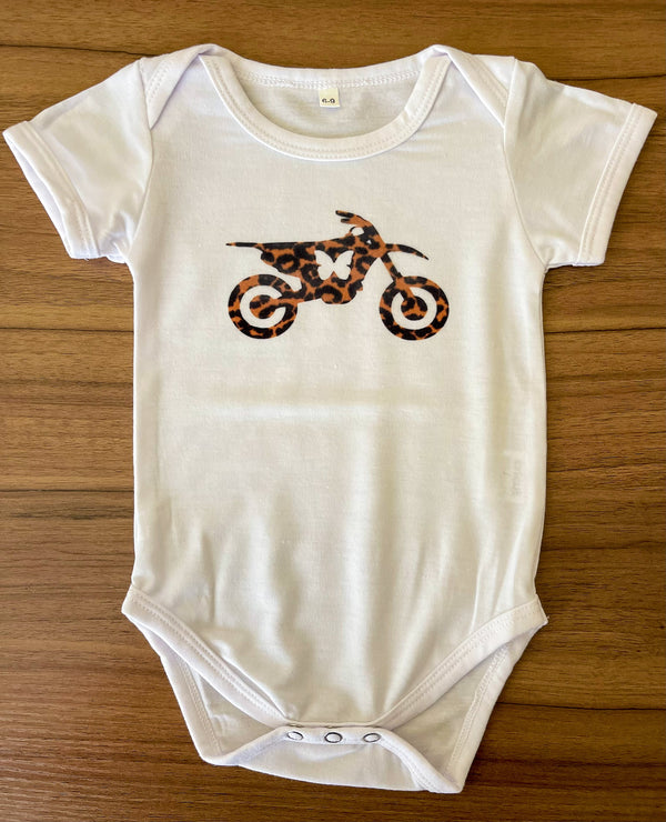 baby onesie with a leopard print butterfly dirt bike on the front