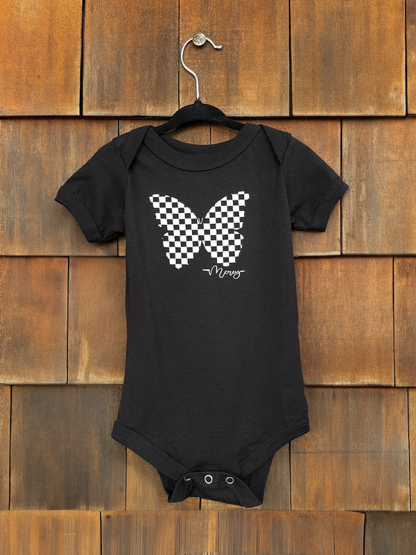 Black baby onesie with a black and white checkered butterfly on the front.