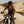 Load image into Gallery viewer, Person riding a dirt bike on a sandy trail
