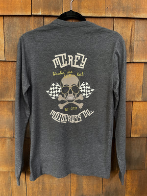 Charcoal grey unisex long sleeve. It features a skull wearing aviators with two checkered flags and the words "Haulin' ass, Still in Last" on the back.