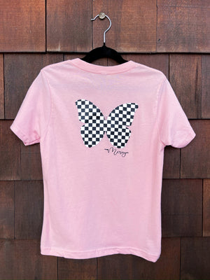 Light pink youth short sleeve shirt with a black and white checkered butterfly on the back