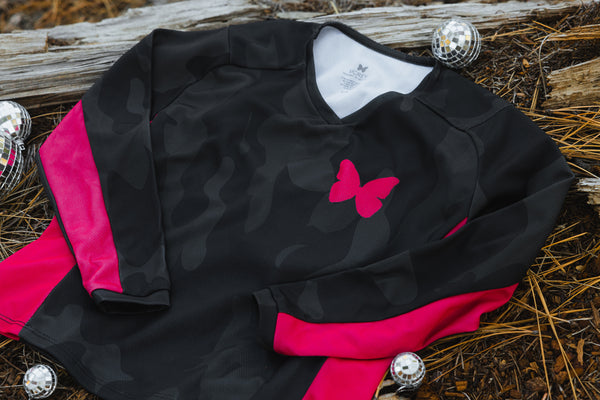 Youth dirt bike jersey for girls in black/grey camo and hot pink sides.