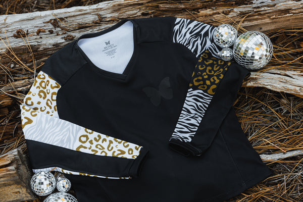 Youth girls dirt bike jersey. It's black with animal print sleeves in gold and silver.