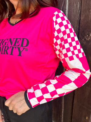 Bright pink long-sleeve shirt with checkered sleeves and 'Designed to get Dirty®' text.