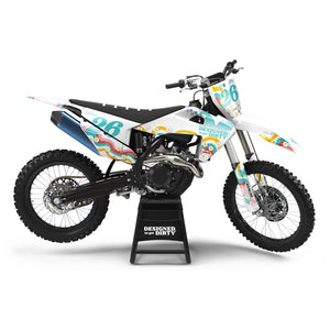 Custom dirt bike graphics in a 70's inspired design. It has multi-colored checkers, wavy lines and daisies.