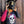 Load image into Gallery viewer, Person wearing a black helmet and black dirt bike jersey with a skull and flowers on the front.
