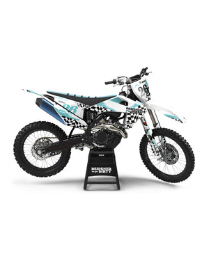 Custom dirt bike graphics kit with black and white checkers and turquoise accents