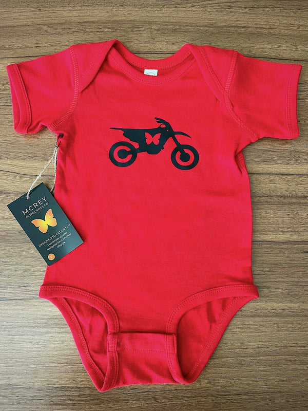 red baby onesie with a black butterfly dirt bike on it