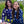 Cargar imagen en el visor de la galería, A woman and a girl laughing at each other. They are wearing matching dirt bike jerseys that are navy blue with white daisies on them.
