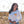 Load image into Gallery viewer, Woman wearing a white long sleeve shirt with small butterfly on the chest. She is laughing while standing in the desert. 
