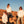Load image into Gallery viewer, Three friends standing on a rock in the desert while the sun is setting. They are wearing unisex hooded sweatshirts with MCREY MOTOCROSS CO logo on the front.
