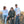 Load image into Gallery viewer, Three friends sit on a rock in the desert. They are laughing. They are wearing motocross long sleeve shirts.
