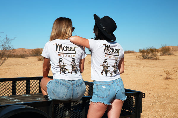 white short sleeve shirt with two girls riding motorcycles