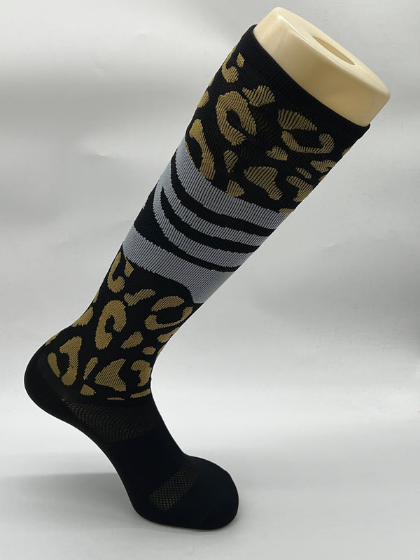 Women's knee-high performance moto socks with animal print. Leopard print and zebra print