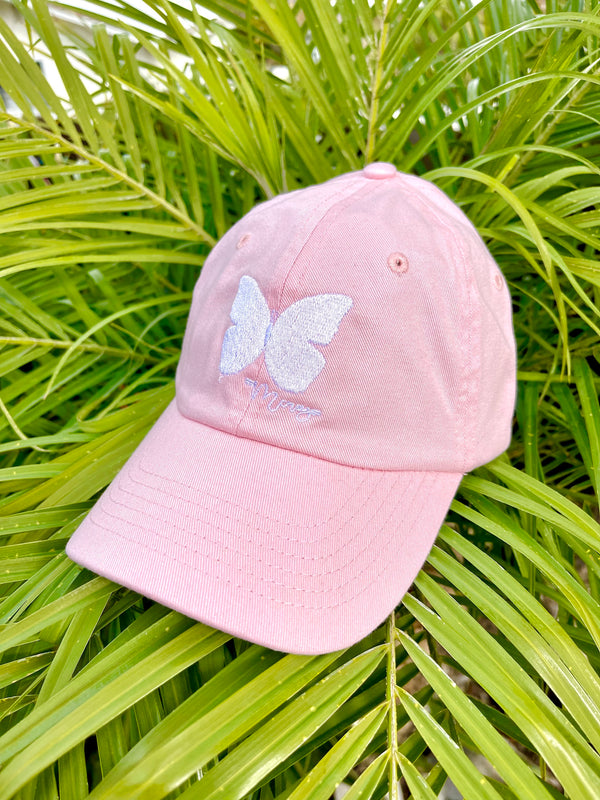 MCREY youth baseball cap in baby pink with a white butterfly 